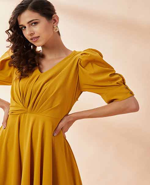 Mustard Angel Sleeve Gown by AAKAAR