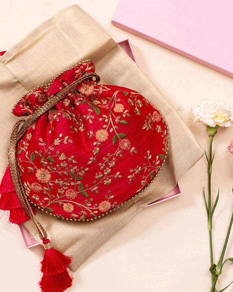 Shop our Handcrafted Floral Creeper Potli with Pastel Floral Embroidery and Cutdana Tassels - Perfect for Traditional and Indo-Western Attire