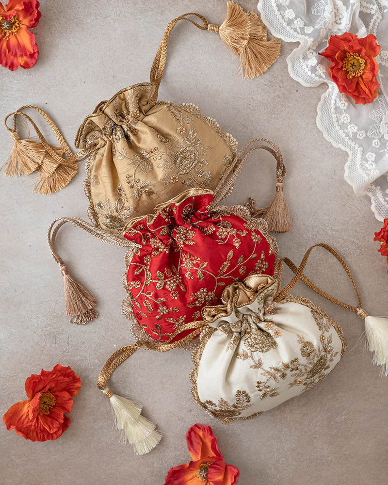 Stunning Royal Potli Bag in Pure Silk with Pearl Embroidery and Cutdana Tassels
