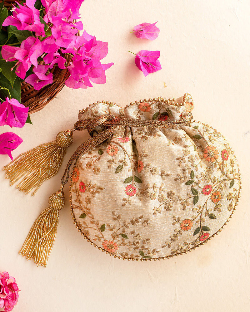 Floral Creeper Cream Potli Bag by AMYRA