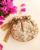Floral Creeper Cream Potli Bag by AMYRA