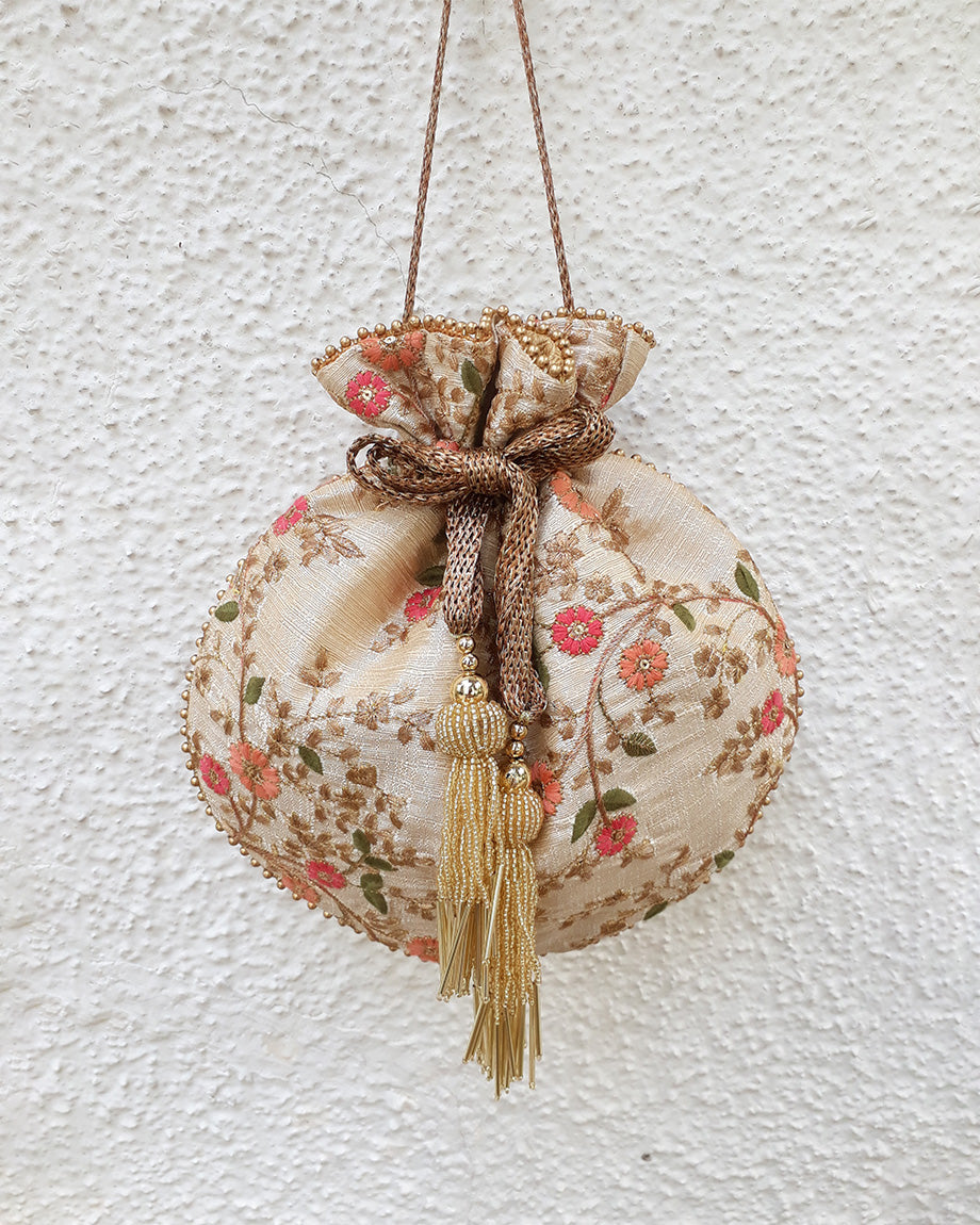 Floral Creeper Cream Potli Bag by AMYRA