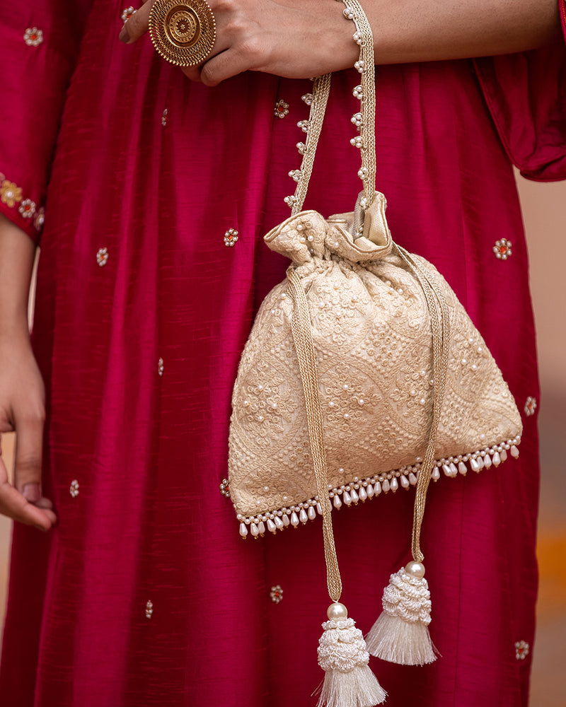 Beige Oyster Potli Bag by AMYRA