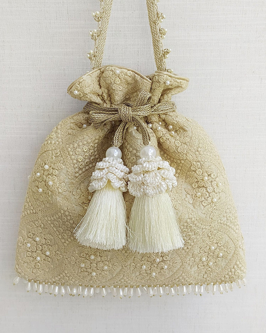 Beige Oyster Potli Bag by AMYRA