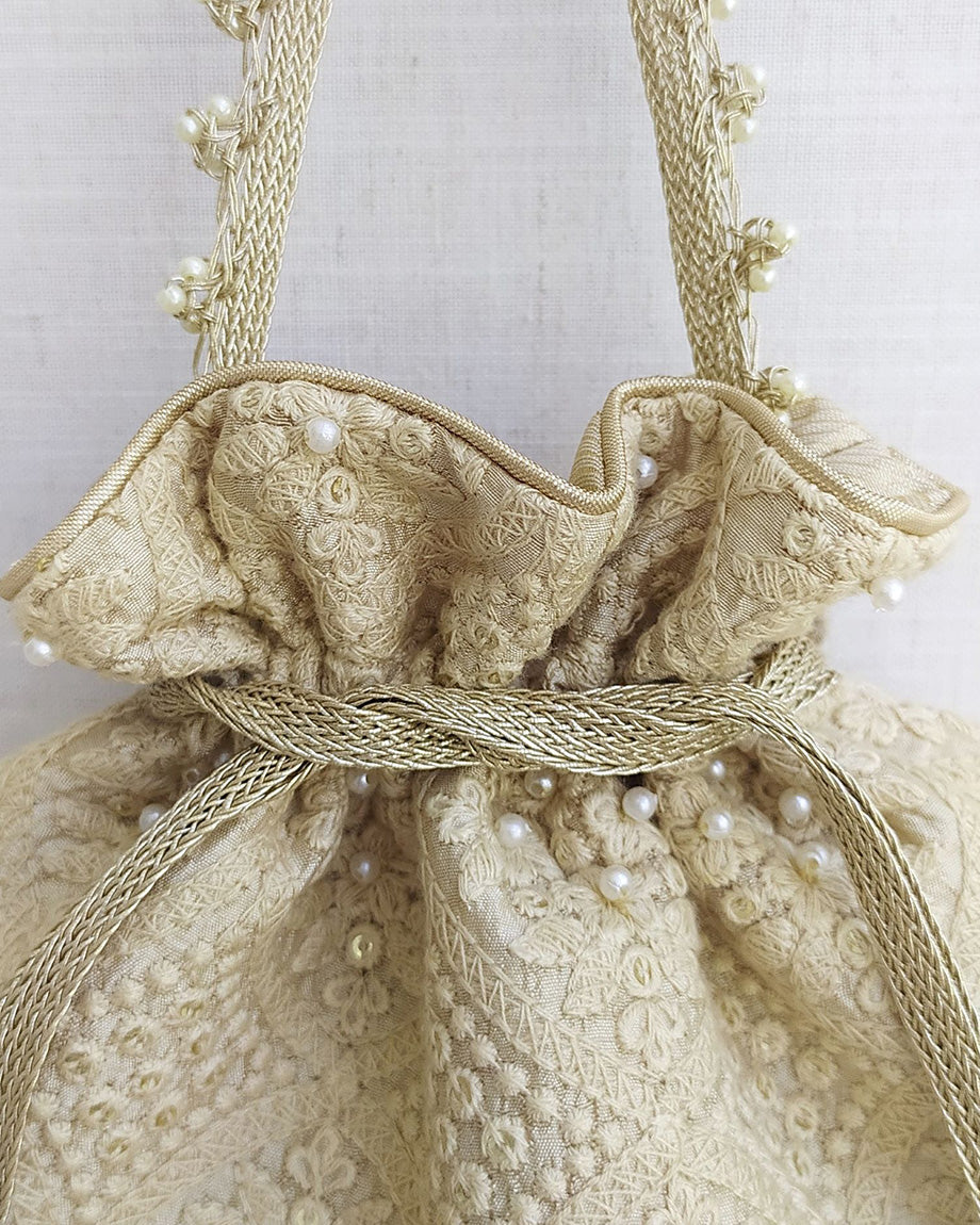 Beige Oyster Potli Bag by AMYRA