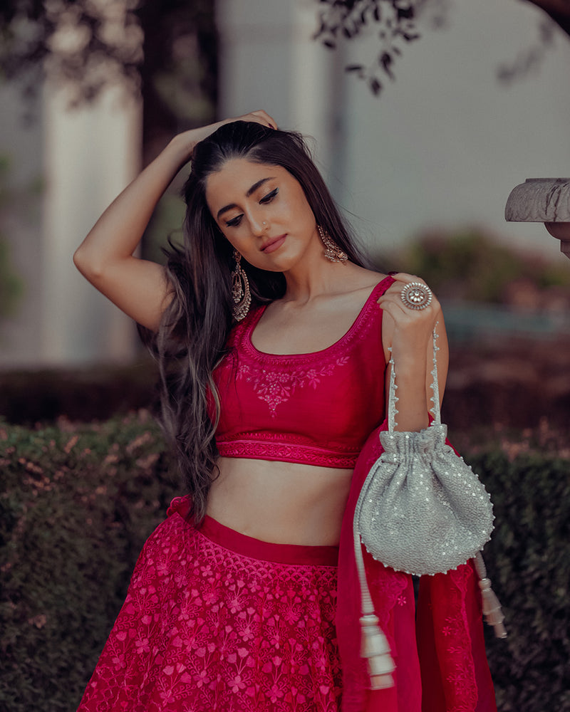 "Shop Our Exquisite Silver Sequin Potli with Pearl Tassels