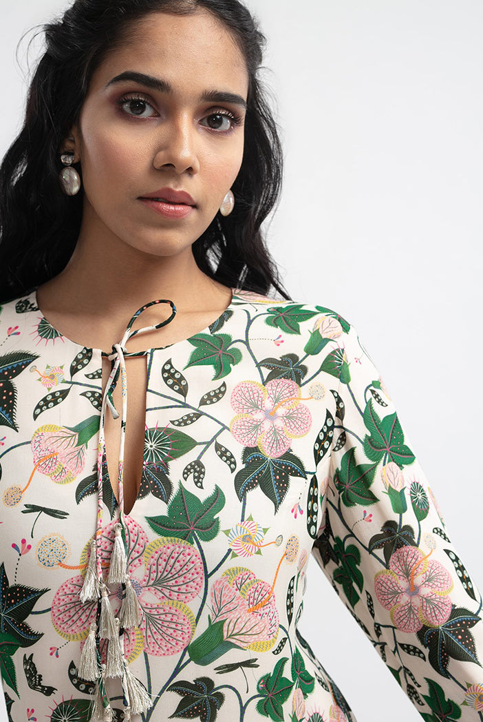 "Model wearing white Abutilon print georgette tiered dress"
