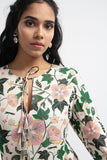 "Model wearing white Abutilon print georgette tiered dress"
