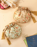 Floral Creeper Cream Potli Bag by AMYRA